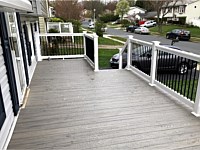 <b>TimberTech Reserve Driftwood Decking with White Washington Railing with Black Aluminum Balusters - Front Porch in Gambrills MD</b>